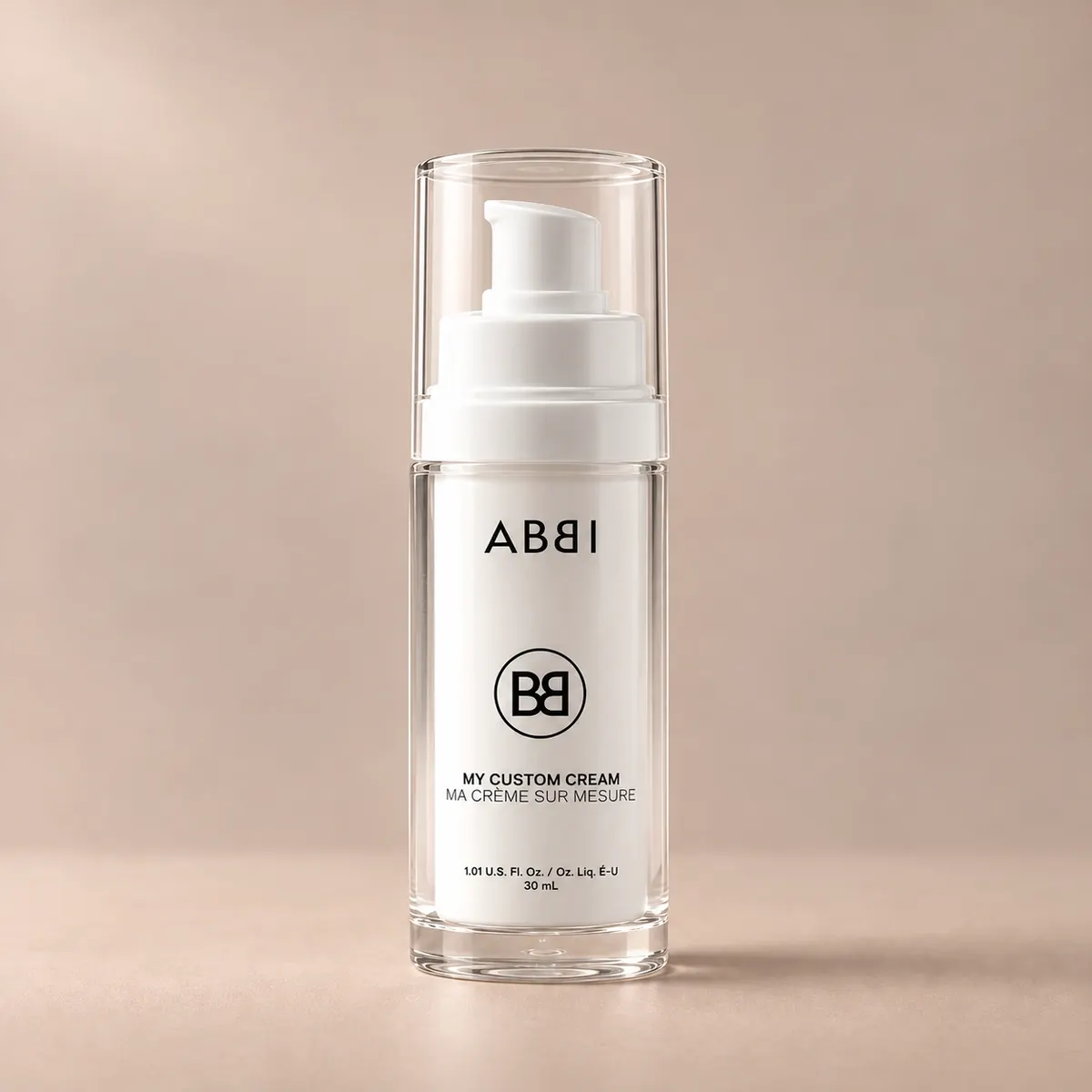 ABBI My Custom Cream with a transparent cap on a warm beige background